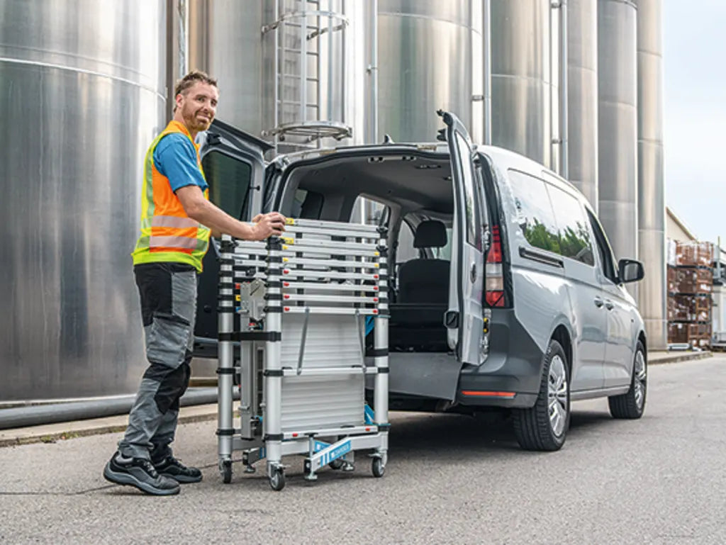 Zarges - Zarges TT002 Teletower Aluminium Telescopic Scaffold Tower with Toeboards - Collapsible ladder cart beside open van door. - imagen 9