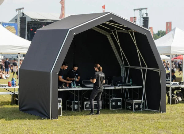 Konligo The Tent folding gazebo set up as a front-of-house booth at a live event
