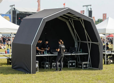 Konligo The Tent folding gazebo set up as a front-of-house booth at a live event