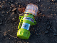 Eflare UB280 Series LED Safety Beacon resting on gravel ground at an outdoor worksite - imagen 7