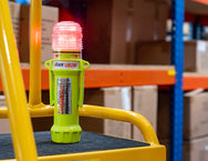 Eflare UB290 Series LED Safety Beacon glowing red while mounted on warehouse shelving racking - imagen 6