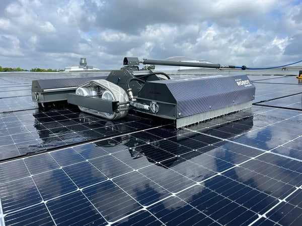 Robot cleaning solar panels on a cloudy day
