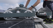 Person using a solar panel cleaning machine on a roof - imagen 16
