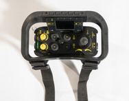 Black handheld device with control buttons and straps on a white background - imagen 6