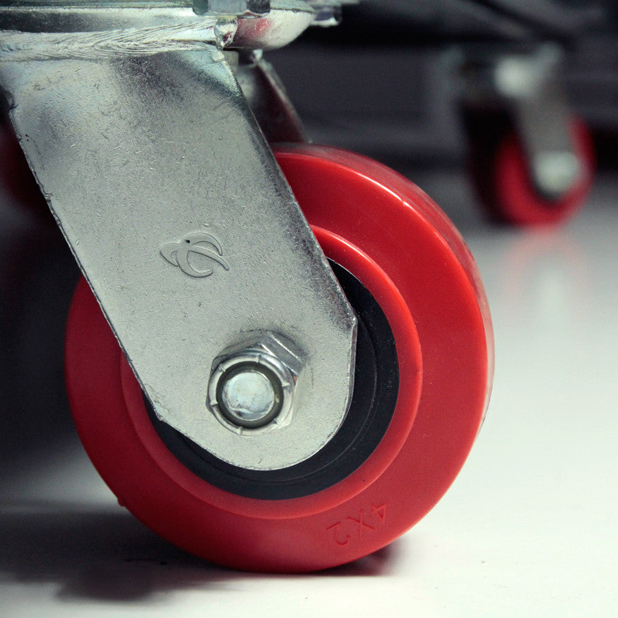 Close-up of a red wheel with metal axle on a blurred background - imagen 4