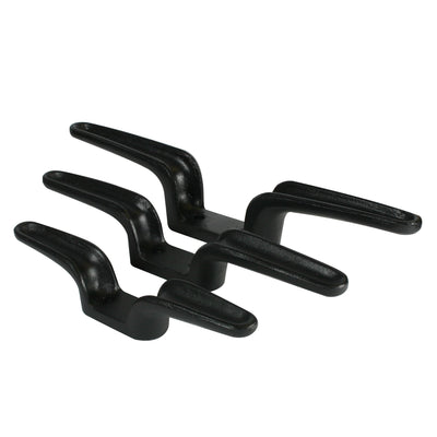 Doughty flyrail cleats — black cast iron wall-mounted cleats for securing and belaying hauling lines at the fly floor in theatre counterweight fly systems
