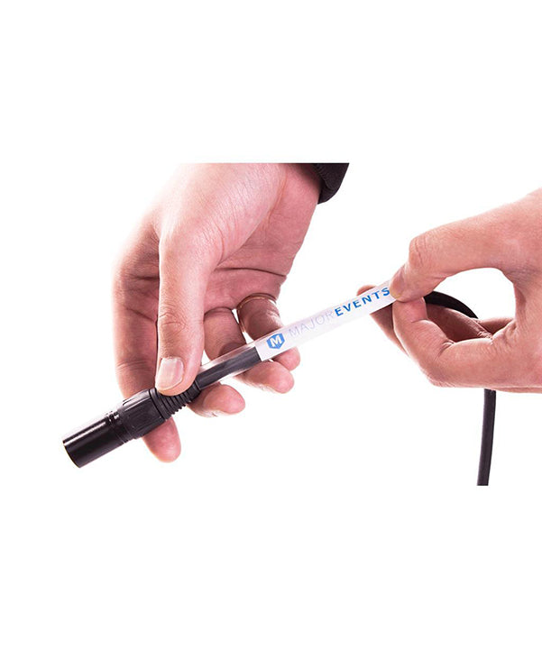 Model holding black cable with label